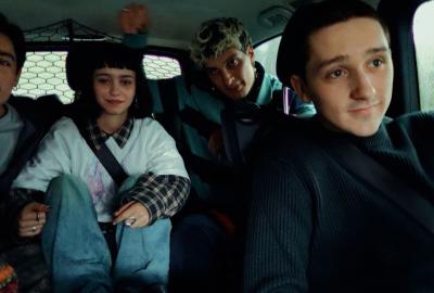 A group of influencers in a vehicle