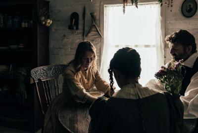 Plural wives sit at the table with their husband