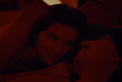 Lucy and Ben share a moment in bed.